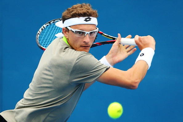 SYDNEY, AUSTRALIA - JANUARY 08: Dennis Istomin of Uzbekistan plays a backhand in his second round match against Marin Cilic of Croatia during day four of the 2014 Sydney International at Sydney Olympic Park Tennis Centre on January 8, 2014 in Sydney, Australia. (Photo by Brendon Thorne/Getty Images)
